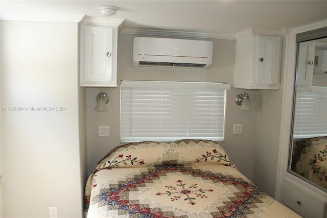 bedroom featuring ornamental molding and a wall mounted air conditioner