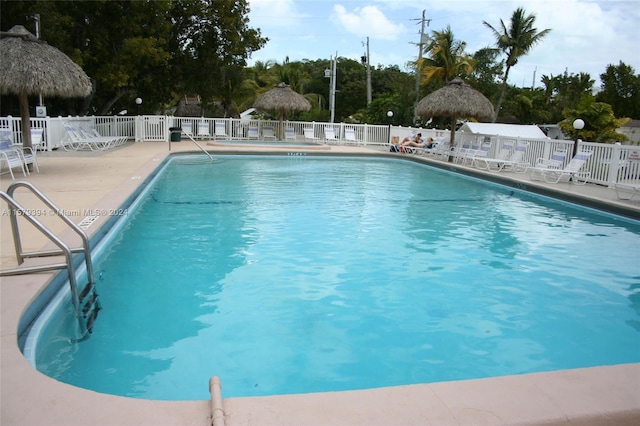 view of swimming pool featuring a gazebo and a patio