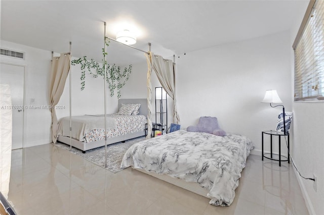 bedroom with tile floors