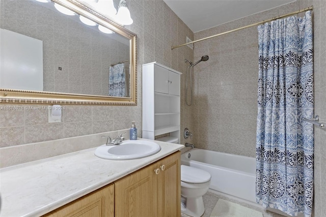 full bathroom featuring tile walls, shower / bath combination with curtain, toilet, tile flooring, and vanity