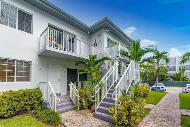 view of front of home with a balcony