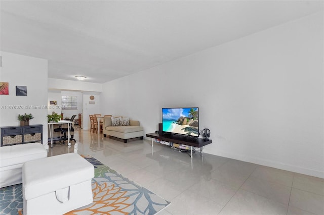 living room with tile flooring