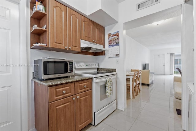 kitchen featuring stone counters, white electric range oven, and light tile floors