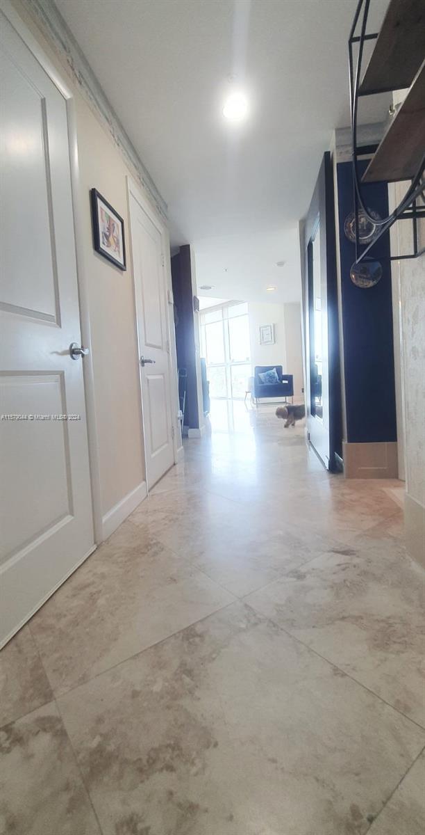 hallway with concrete flooring