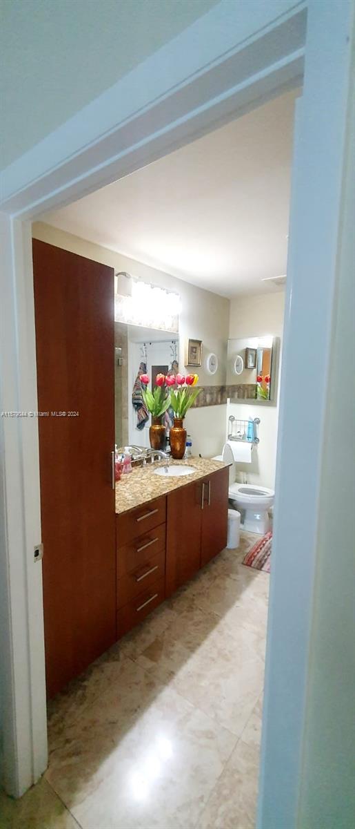 interior space with sink and light tile flooring