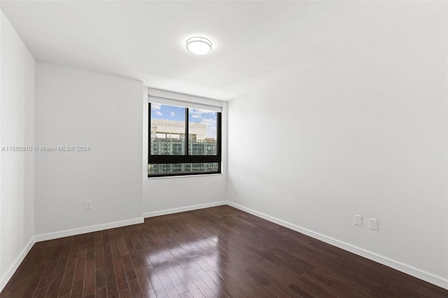 spare room with hardwood / wood-style flooring