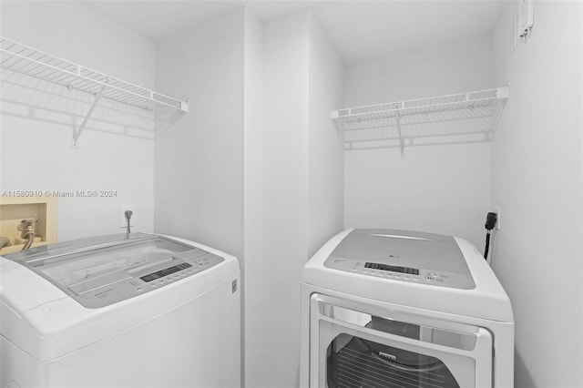 washroom featuring separate washer and dryer