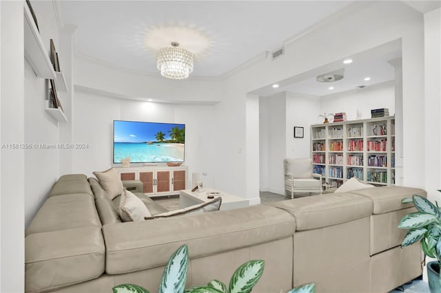 living room featuring an inviting chandelier and crown molding