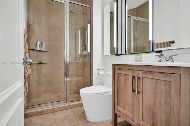 bathroom featuring tile flooring, vanity with extensive cabinet space, an enclosed shower, and toilet