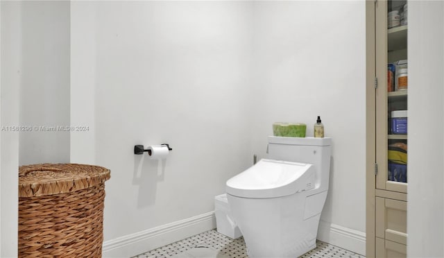 bathroom with tile flooring