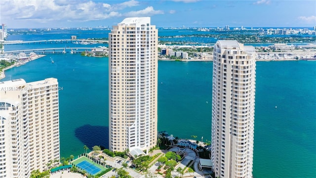 birds eye view of property with a water view