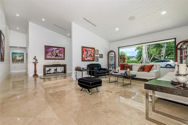 living room with high vaulted ceiling and wood ceiling