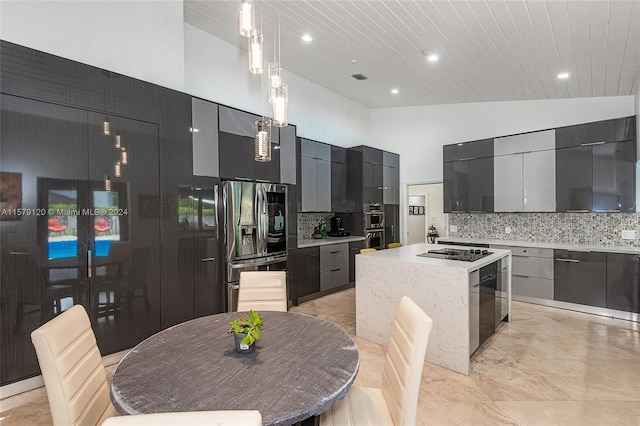 kitchen with tasteful backsplash, a center island, decorative light fixtures, and stainless steel refrigerator with ice dispenser