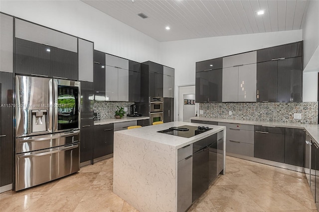 kitchen with appliances with stainless steel finishes, backsplash, wood ceiling, vaulted ceiling, and a kitchen island