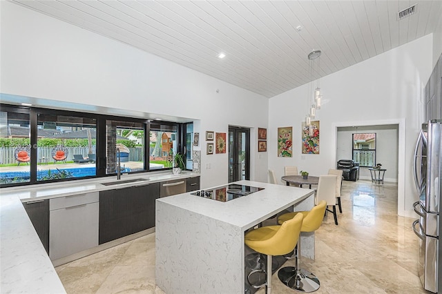 kitchen with decorative light fixtures, a center island, black electric cooktop, and wooden ceiling