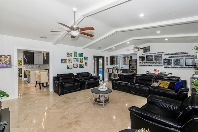 living room featuring lofted ceiling with beams and ceiling fan