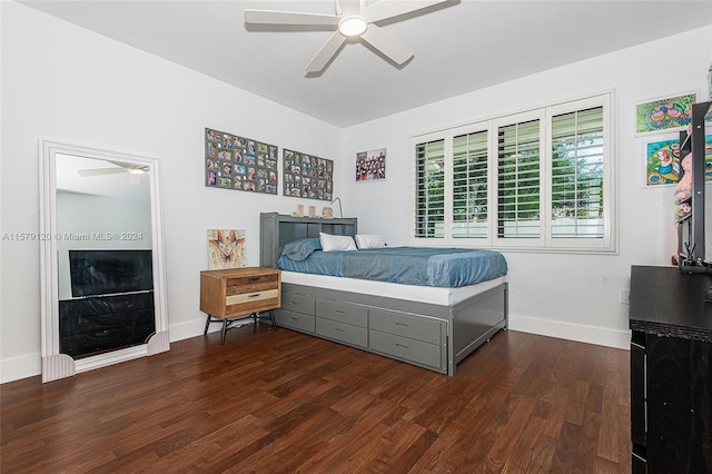 bedroom with ceiling fan and dark hardwood / wood-style floors