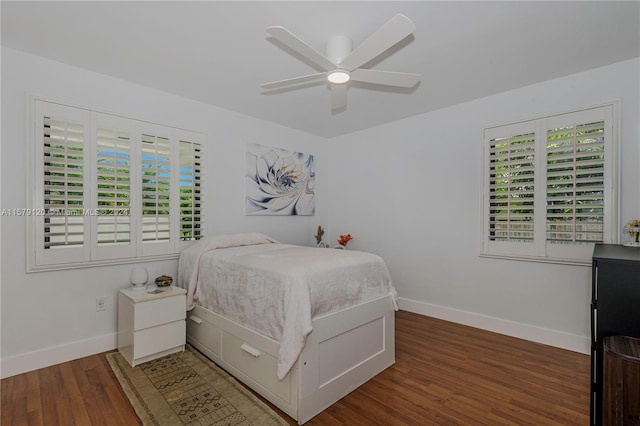 bedroom with ceiling fan and dark hardwood / wood-style floors