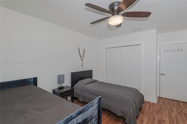 bedroom featuring a closet, ceiling fan, and light hardwood / wood-style flooring