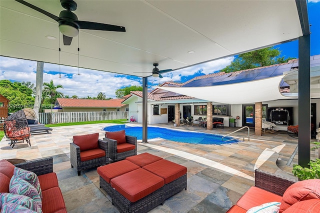 view of pool featuring ceiling fan and a patio