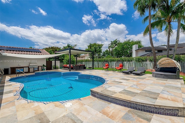 view of swimming pool featuring an outdoor living space, a patio area, and grilling area