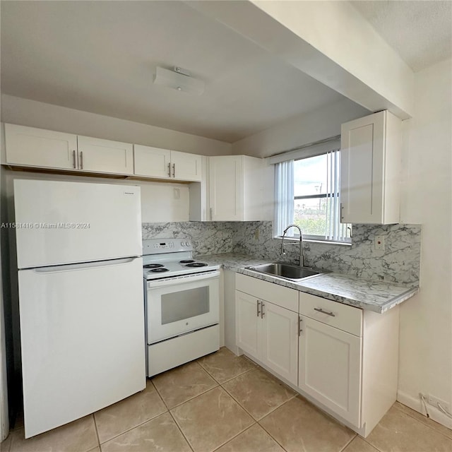 kitchen featuring decorative backsplash, sink, light tile patterned flooring, white cabinetry, and white appliances