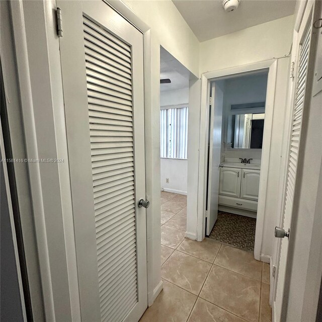 hallway with light tile patterned floors