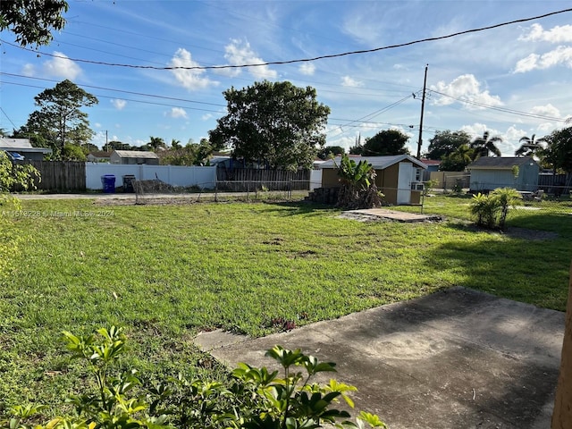 view of yard with a patio area and an outdoor structure