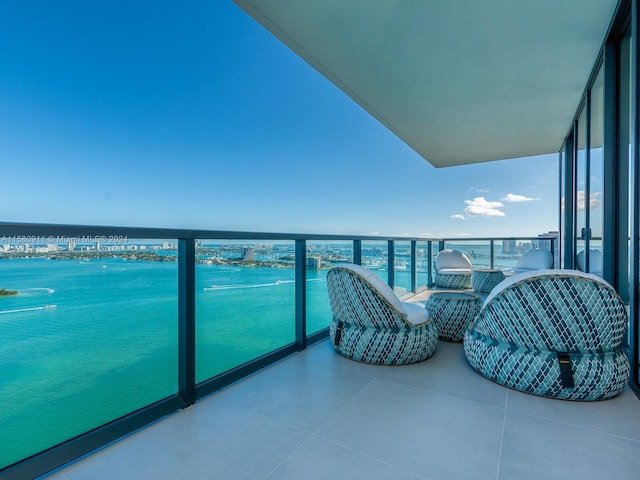 balcony featuring a water view