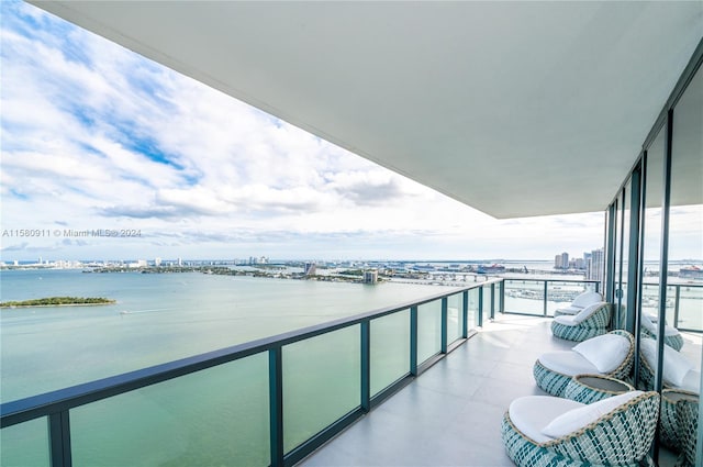 balcony featuring a water view