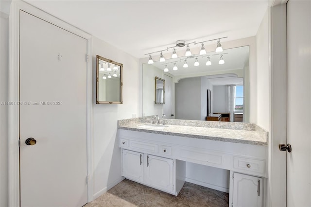 bathroom with tile patterned flooring and vanity