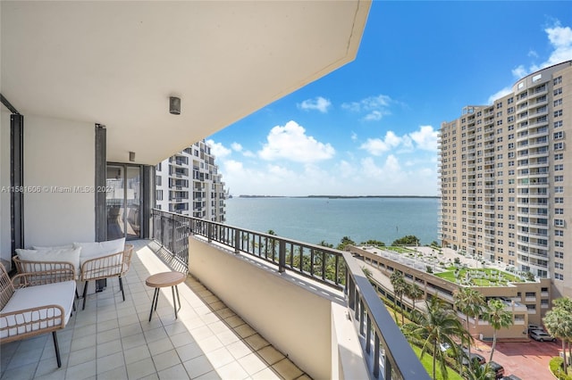 balcony featuring a water view