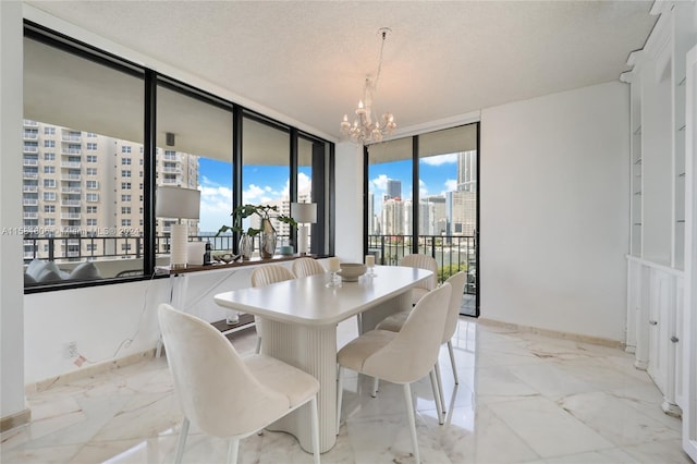 dining area featuring expansive windows, a textured ceiling, and a notable chandelier