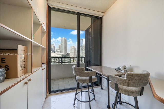 office area with floor to ceiling windows