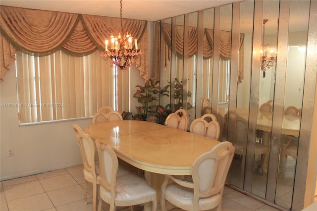 dining space featuring light tile patterned floors and a notable chandelier