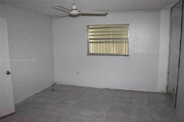 unfurnished room with ceiling fan