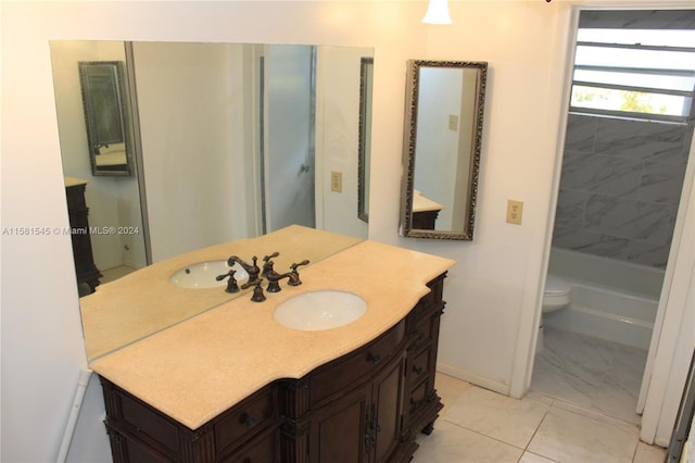 bathroom featuring tile patterned floors, vanity, and toilet