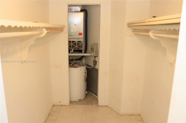 utility room with gas water heater