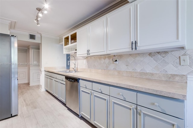 kitchen featuring a sink, visible vents, appliances with stainless steel finishes, open shelves, and crown molding