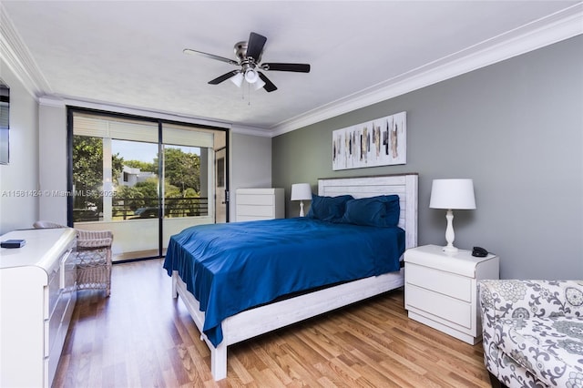 bedroom featuring access to exterior, ornamental molding, and wood finished floors