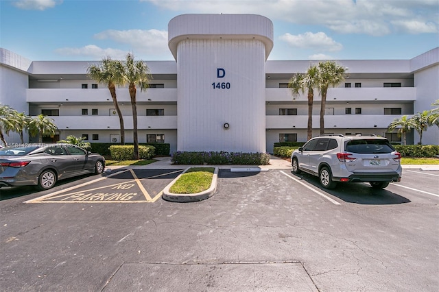 view of property with uncovered parking