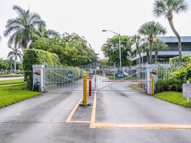 view of gate featuring fence