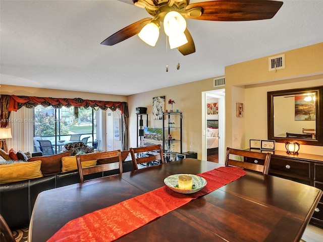 dining room featuring ceiling fan