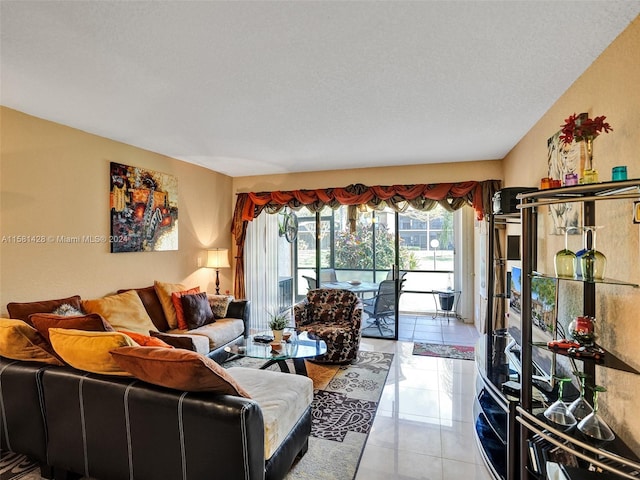 living room featuring tile flooring and a textured ceiling