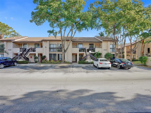 view of front of home featuring a balcony