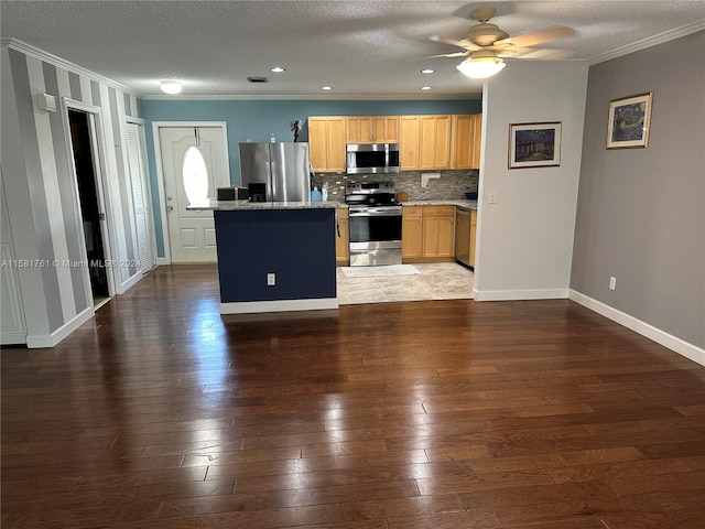 kitchen with appliances with stainless steel finishes, ceiling fan, a textured ceiling, tasteful backsplash, and dark hardwood / wood-style flooring