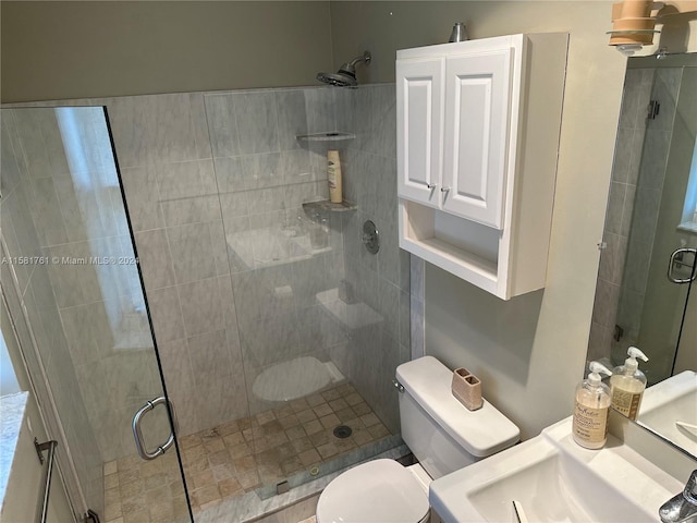 bathroom featuring an enclosed shower and toilet