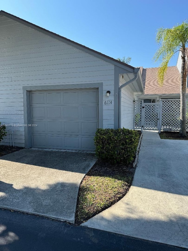 view of property exterior with a garage