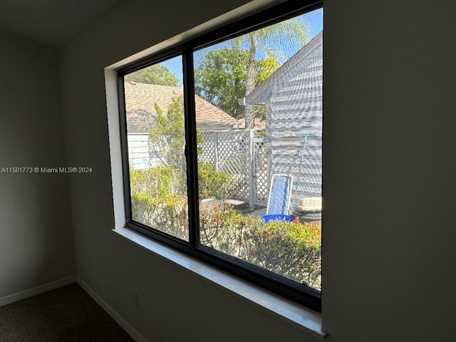 6114 SE Georgetown Pl, Hobe Sound, FL 33455 - interior details with baseboards and carpet flooring