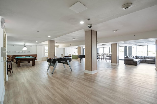 game room with light wood-type flooring and pool table